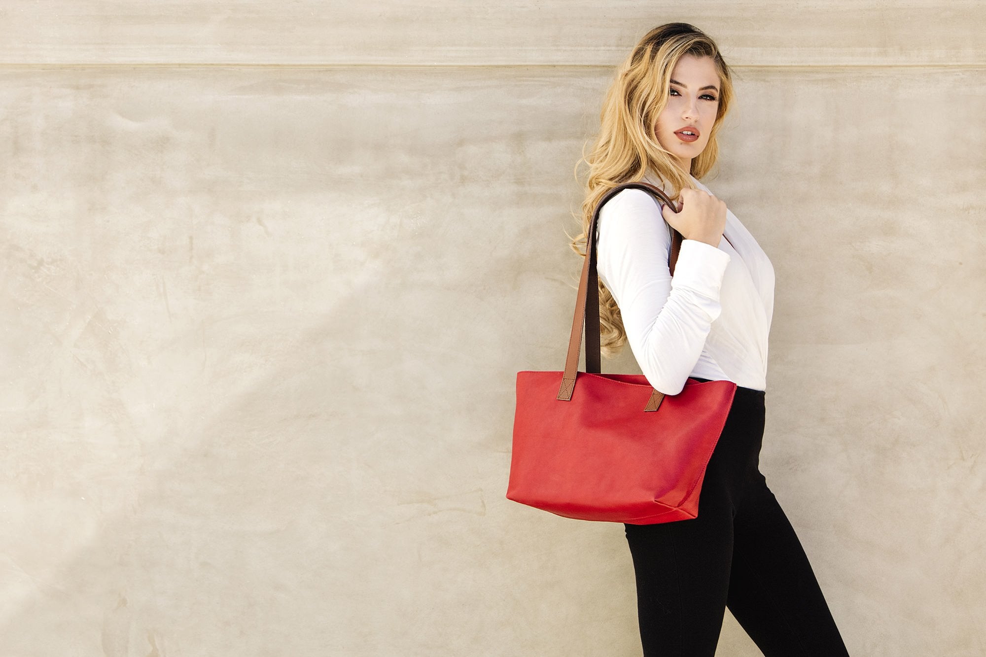 Red genuine leather tote bag with bowl-shaped design and center handles for everyday use