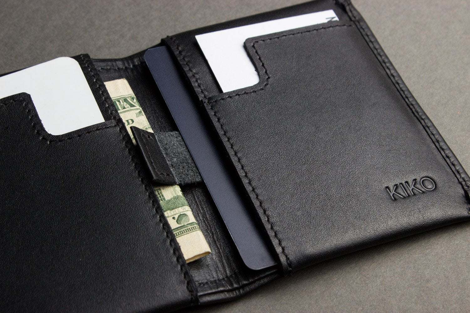 Kiko Slim Bifold Wallet handcrafted leather with 2 card slots and quick-access pocket holding folded cash