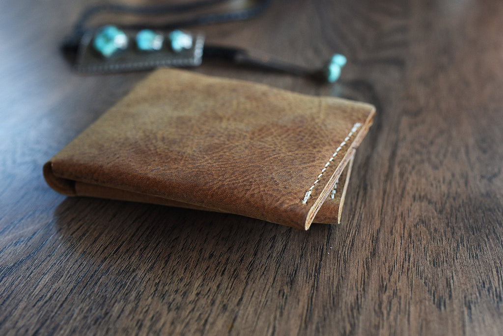 Buck Bifold Leather Wallet made of smooth cowhide leather with contrast stitching and six card slots