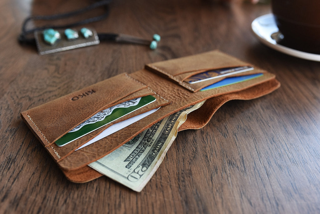 Buck Bifold Leather Wallet made from smooth cowhide leather with contrast stitching and six card slots