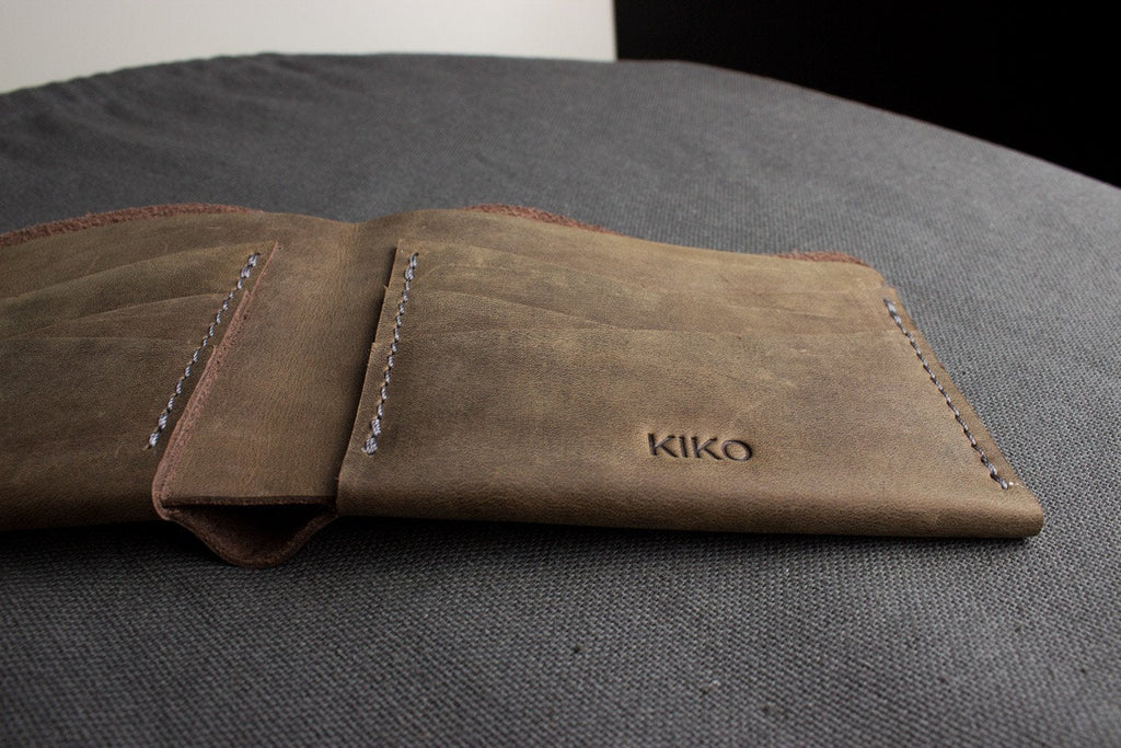 Buck Bifold Leather Wallet made from smooth cowhide leather with contrast stitching and six card slots