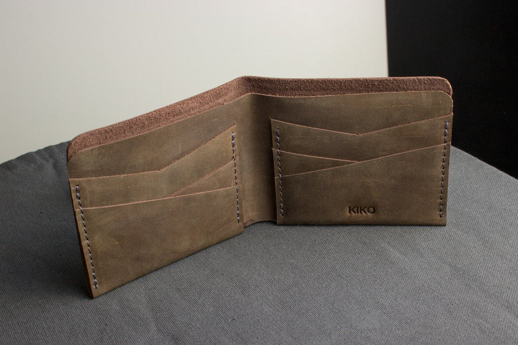 Buck Bifold Leather Wallet made from smooth cowhide leather with contrast stitching and six card slots