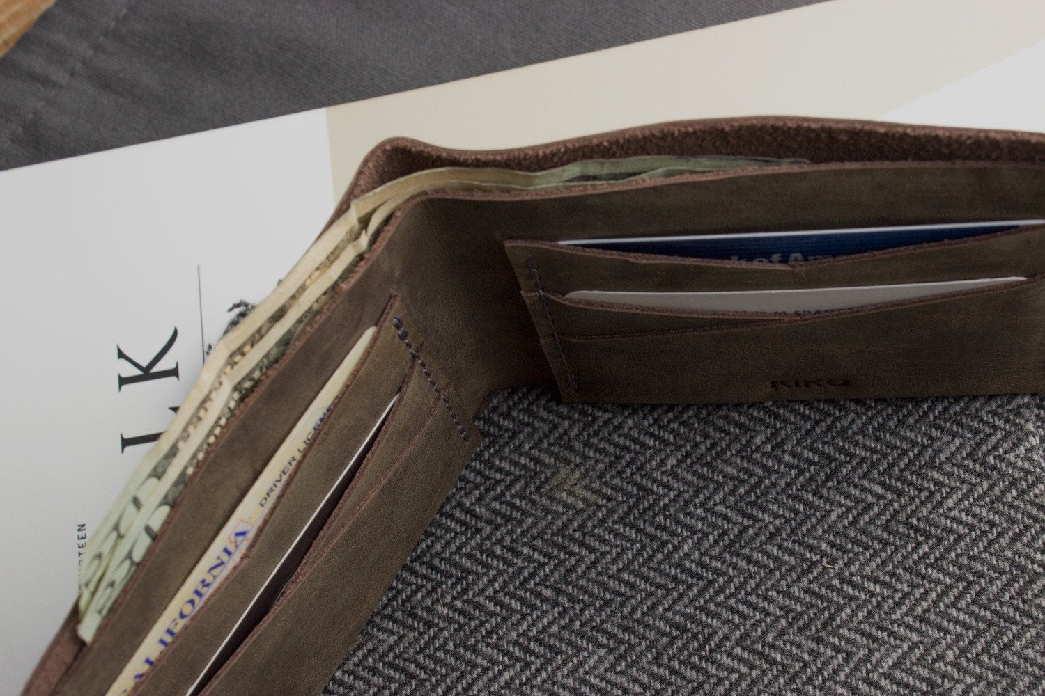 Buck Bifold Leather Wallet made from smooth cowhide leather with contrast stitching and six card slots