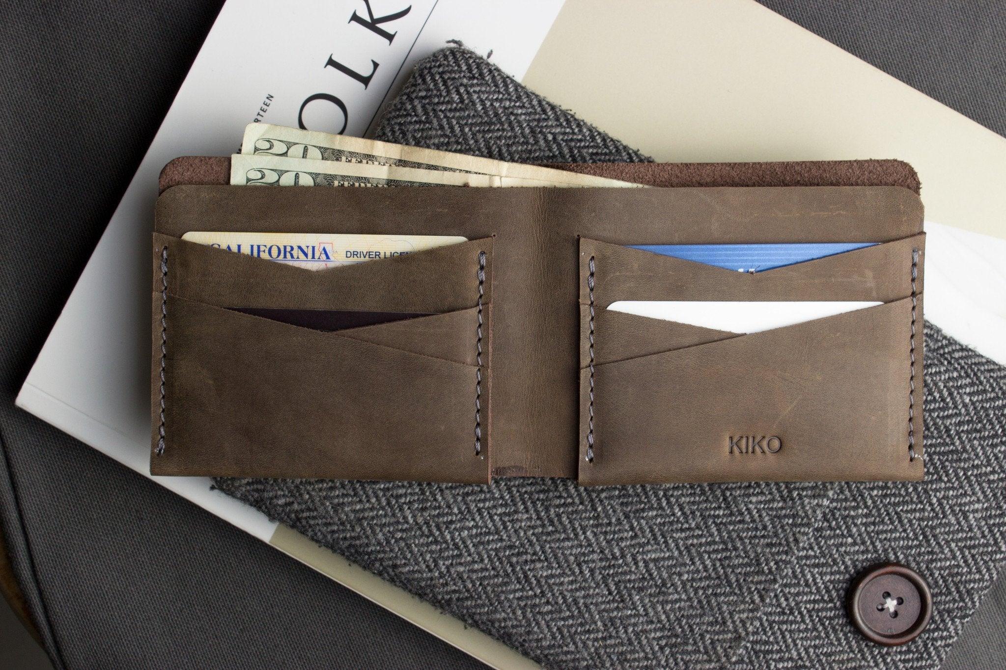 Buck Bifold leather wallet made from smooth cowhide with contrast stitching and six card slots.