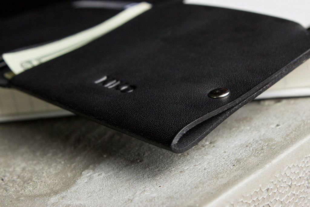 Unstitched leather twofold wallet in vegetable-tanned cowhide with full-length billfold and two card slots