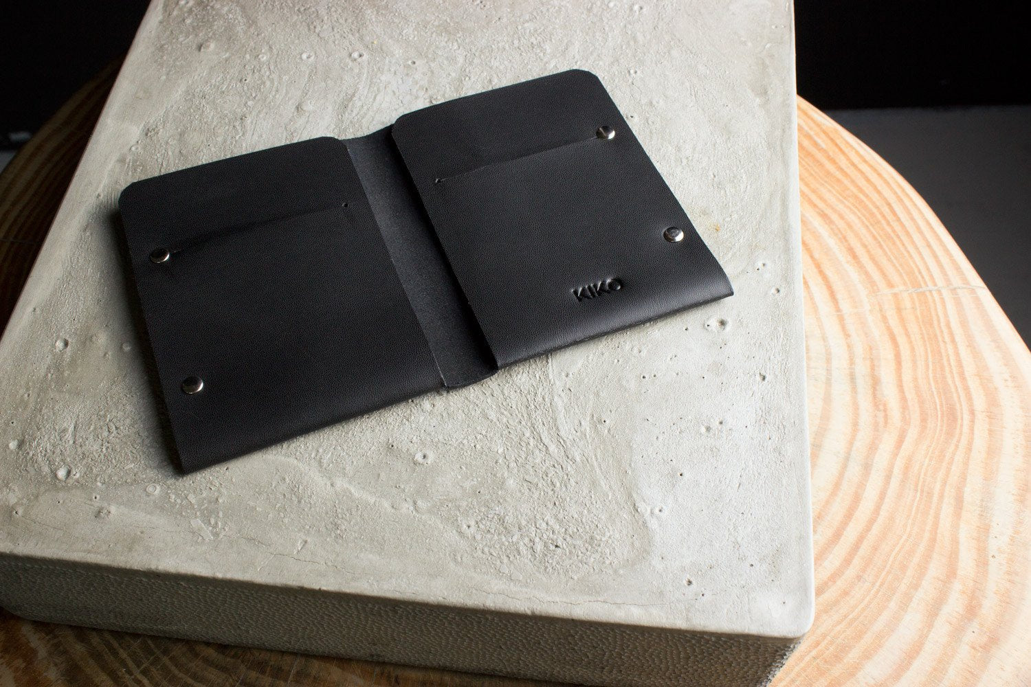 Unstitched leather twofold wallet made from vegetable-tanned cowhide with full-length billfold and two card slots