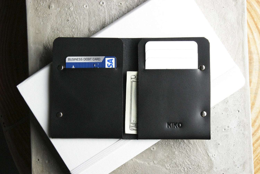 Unstitched leather twofold wallet made from vegetable-tanned cowhide with billfold and card slots