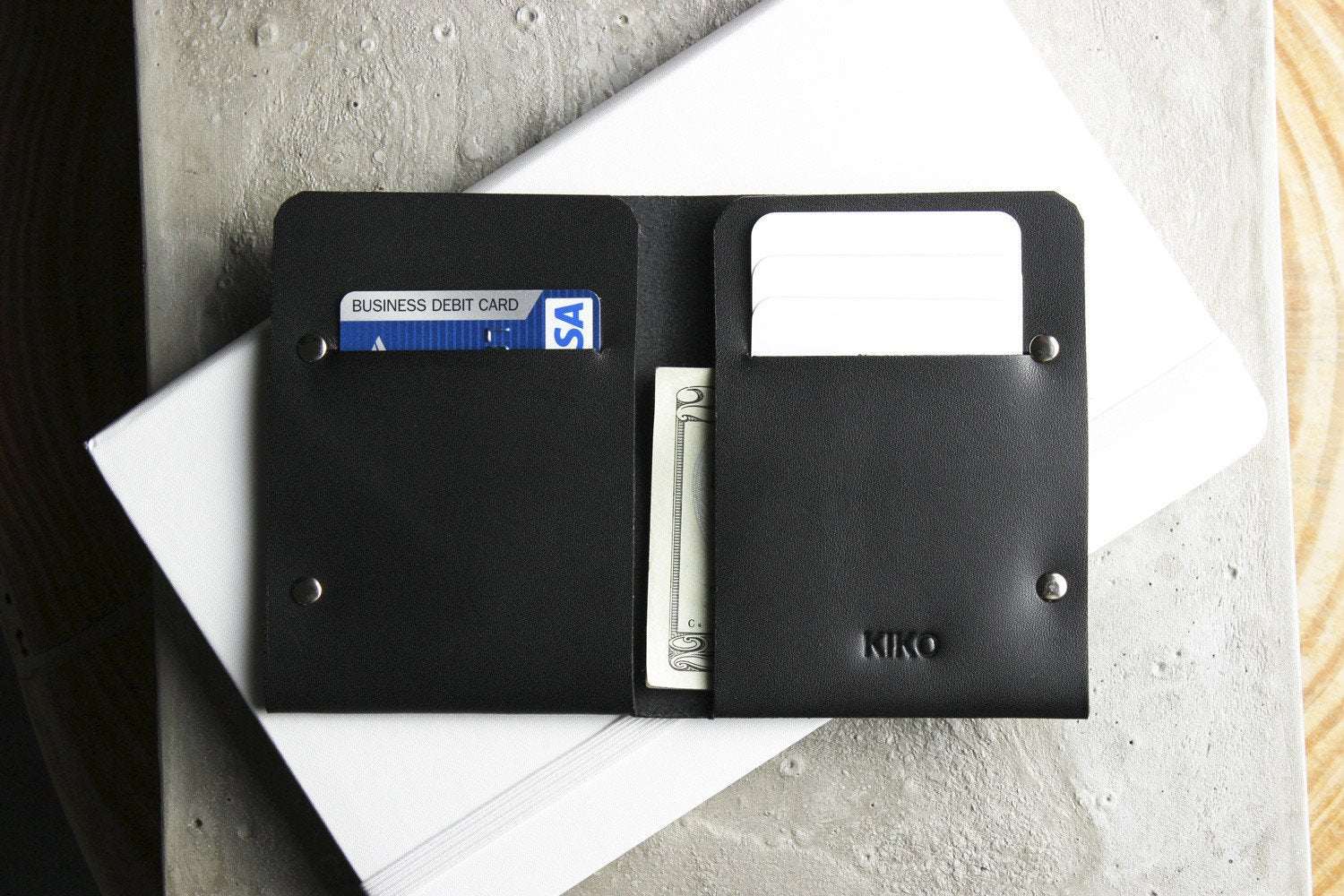 Unstitched leather twofold wallet made from vegetable-tanned cowhide with billfold and card slots