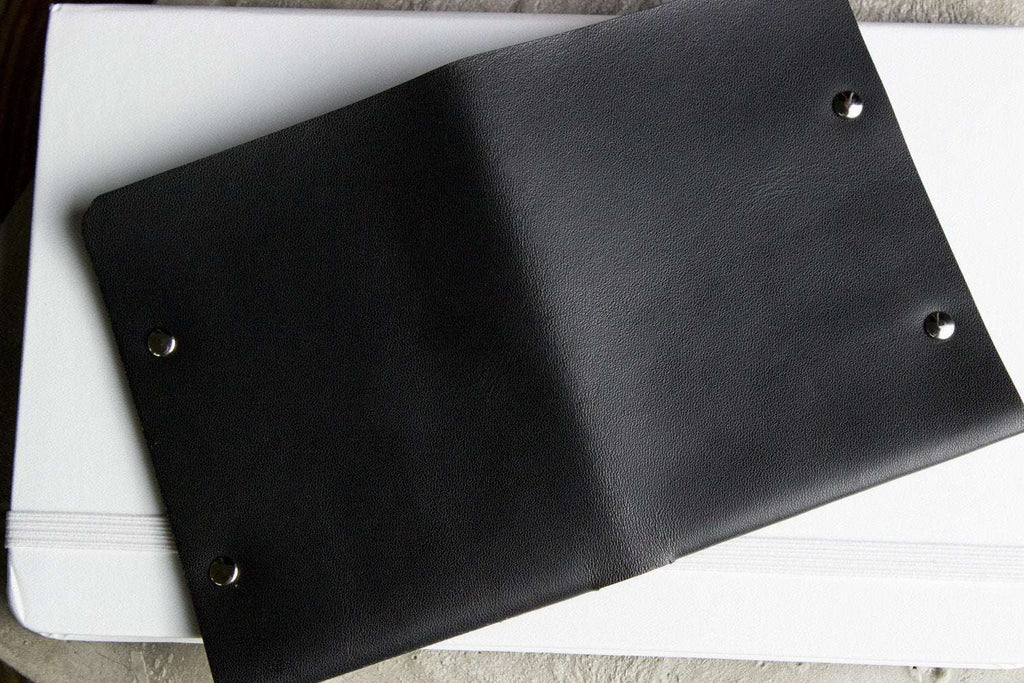 Unstitched leather twofold wallet made from vegetable-tanned cowhide with billfold and card slots, minimalist design