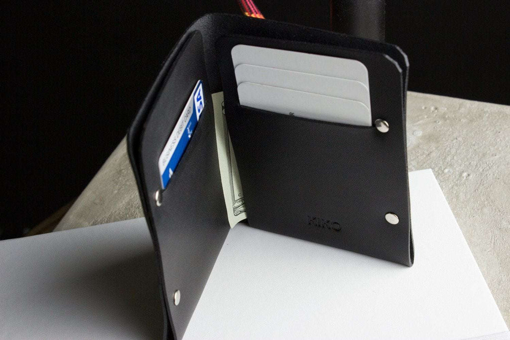 Unstitched leather twofold wallet made from vegetable-tanned cowhide with billfold and card slots, minimalist design