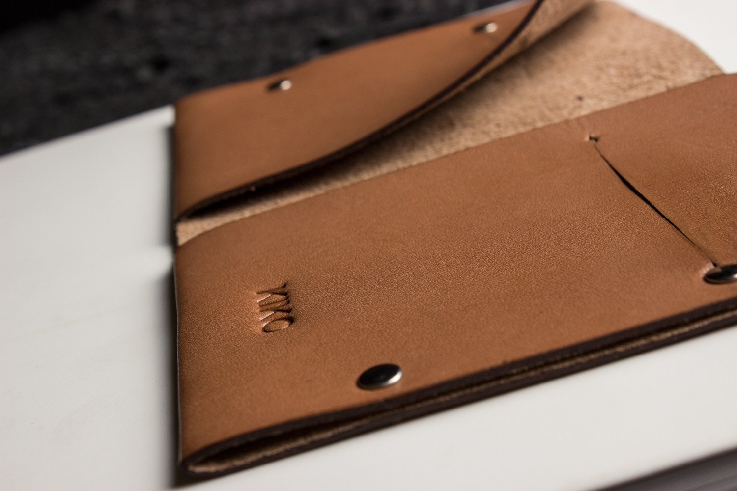 Unstitched leather twofold wallet made from vegetable-tanned cowhide with minimalist design and full-length billfold compartment