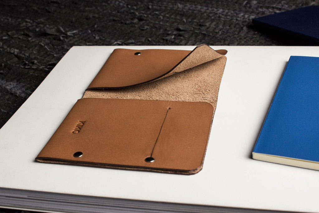 Unstitched leather twofold wallet handmade from vegetable-tanned cowhide with minimalist design and card slots