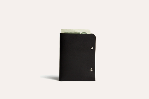 Unstitched leather twofold wallet made from vegetable-tanned cowhide with billfold compartment and card slots