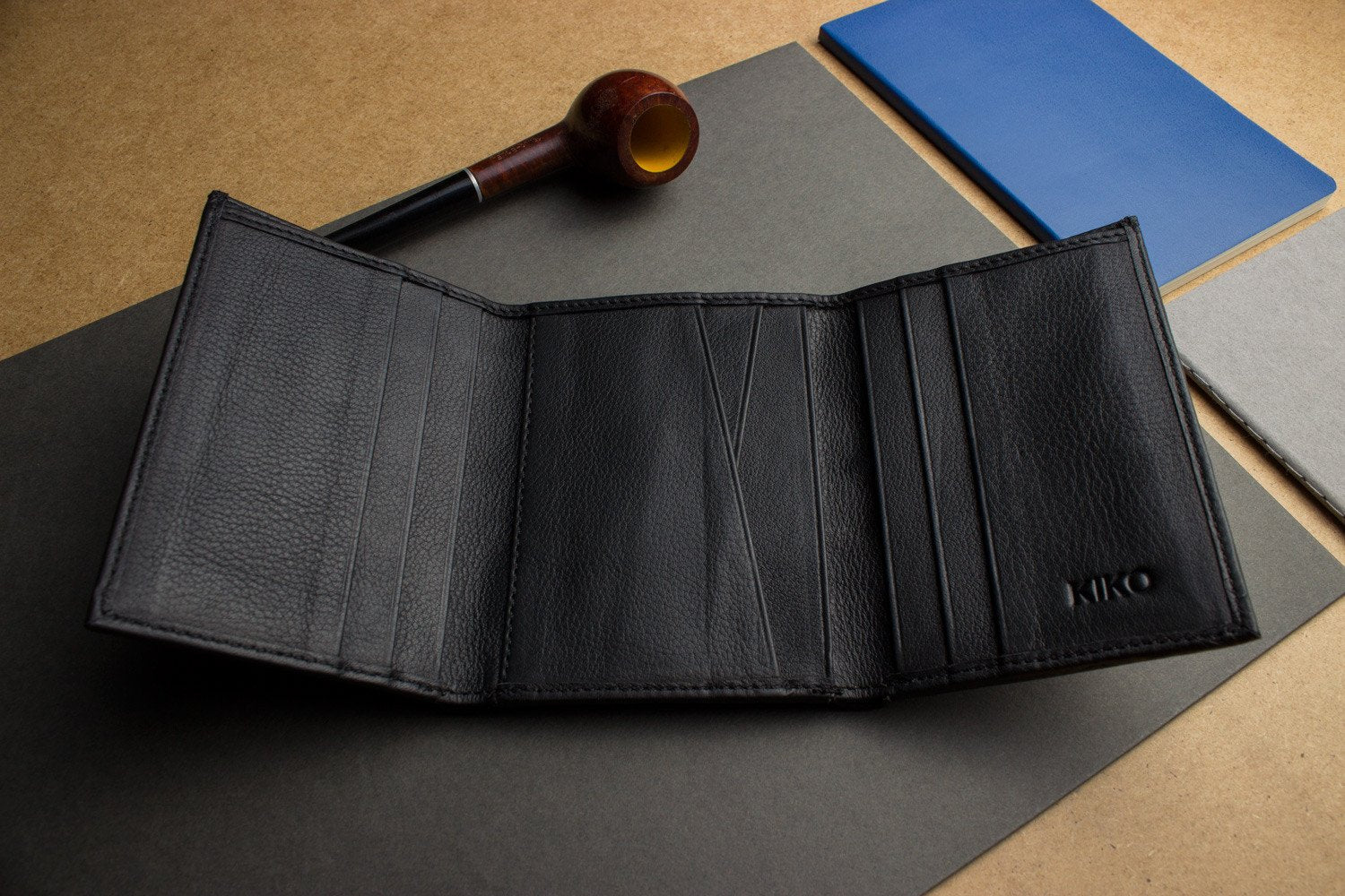 Leather trifold wallet made of butter soft full grain cowhide with 9 card slots and ID window