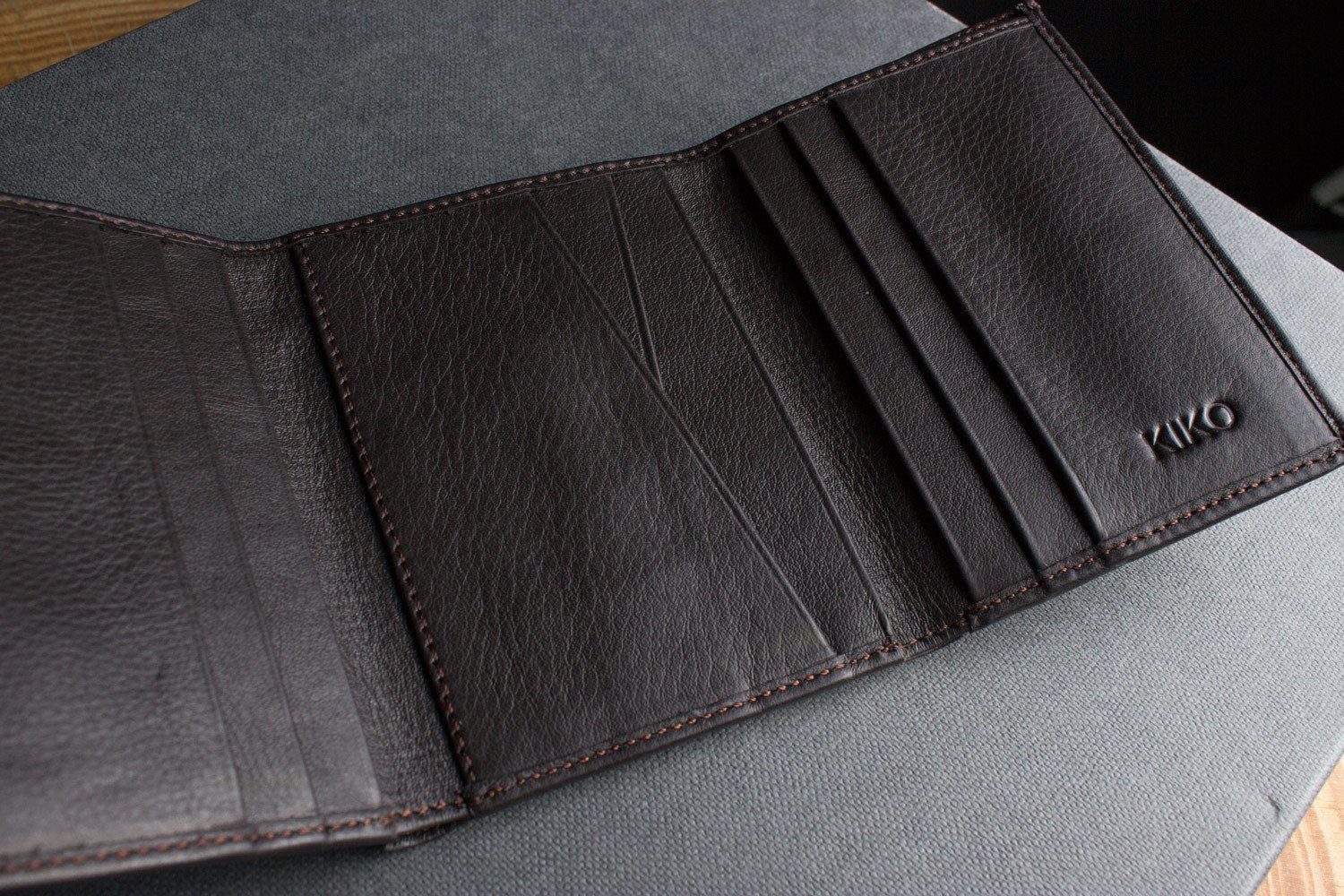 Kiko leather trifold wallet made from butter soft full grain cowhide with 9 card slots and ID window