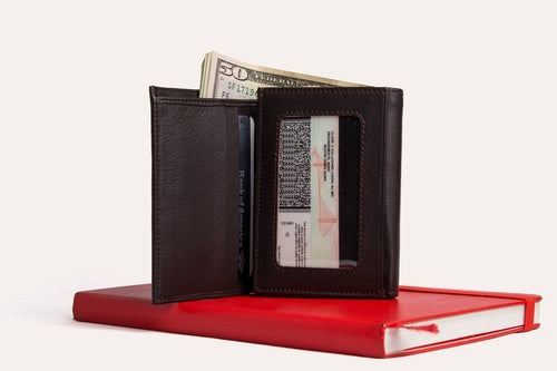 Elegant leather trifold wallet made from soft full grain cowhide with multiple card slots and ID window