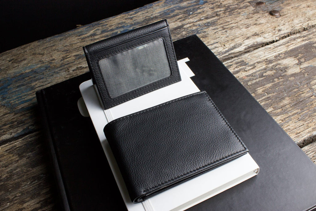 Traditional bifold wallet made of glove-tanned cowhide leather with multiple card slots and ID window