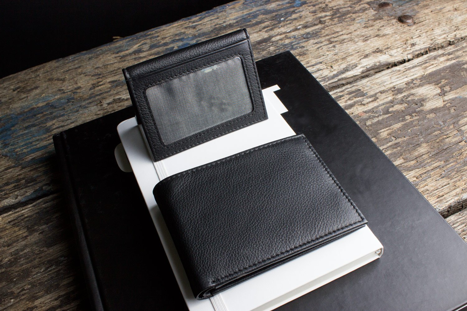 Traditional bifold wallet made of glove-tanned cowhide leather with multiple card slots and ID window