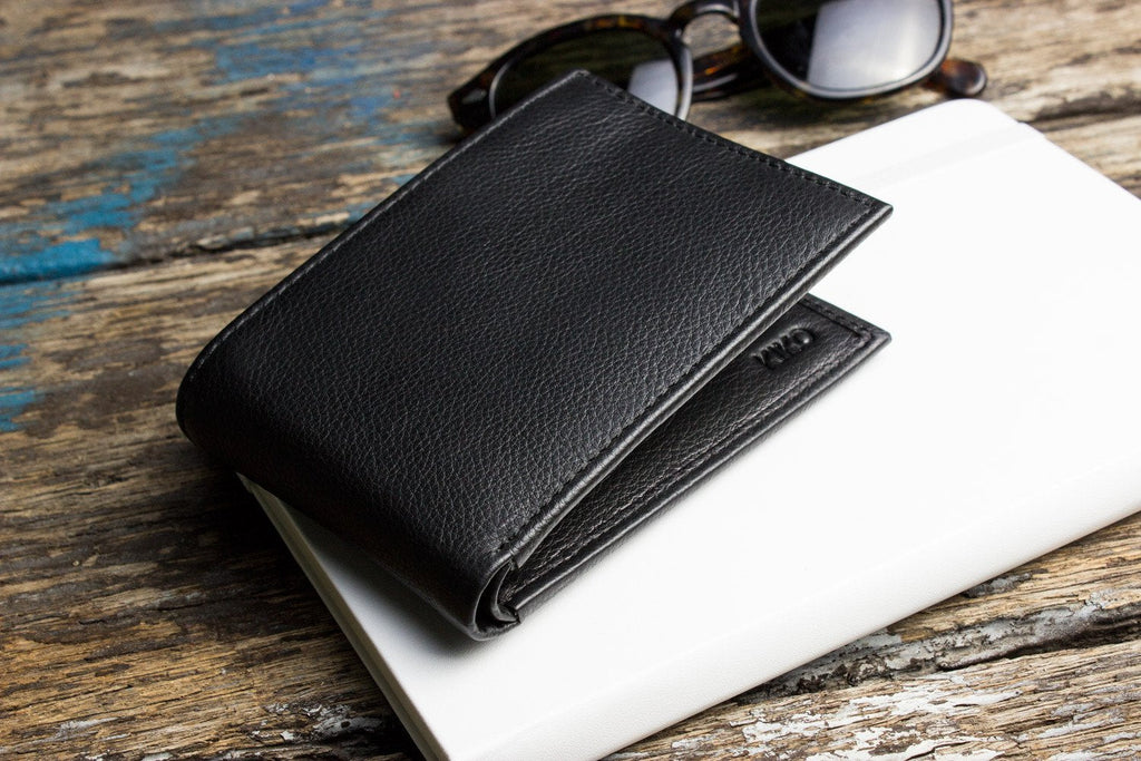 Traditional bifold wallet in glove tanned cowhide leather with removable ID window and multiple card slots