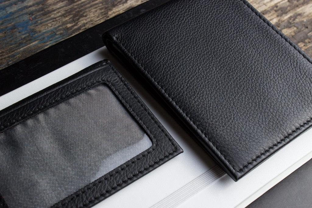 Traditional bifold wallet made of glove tanned cowhide leather with removable ID window and 8 card slots