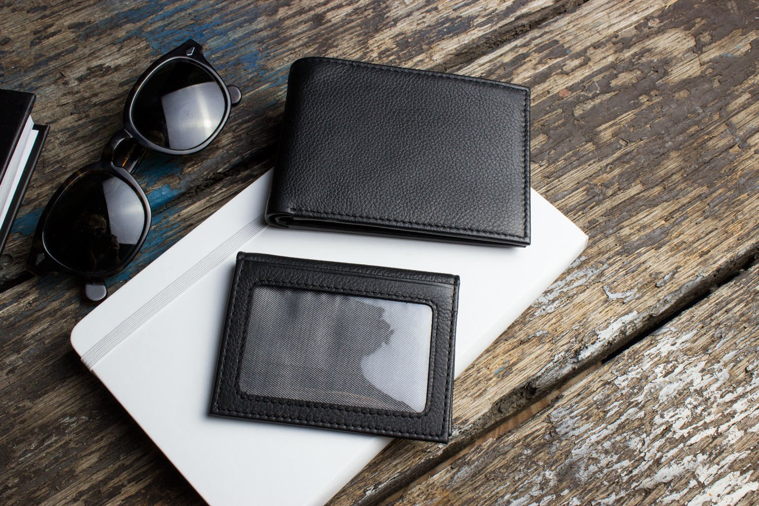 Traditional bifold wallet made of glove tanned cowhide leather with removable ID window, 8 card slots, and 2 bill compartments.