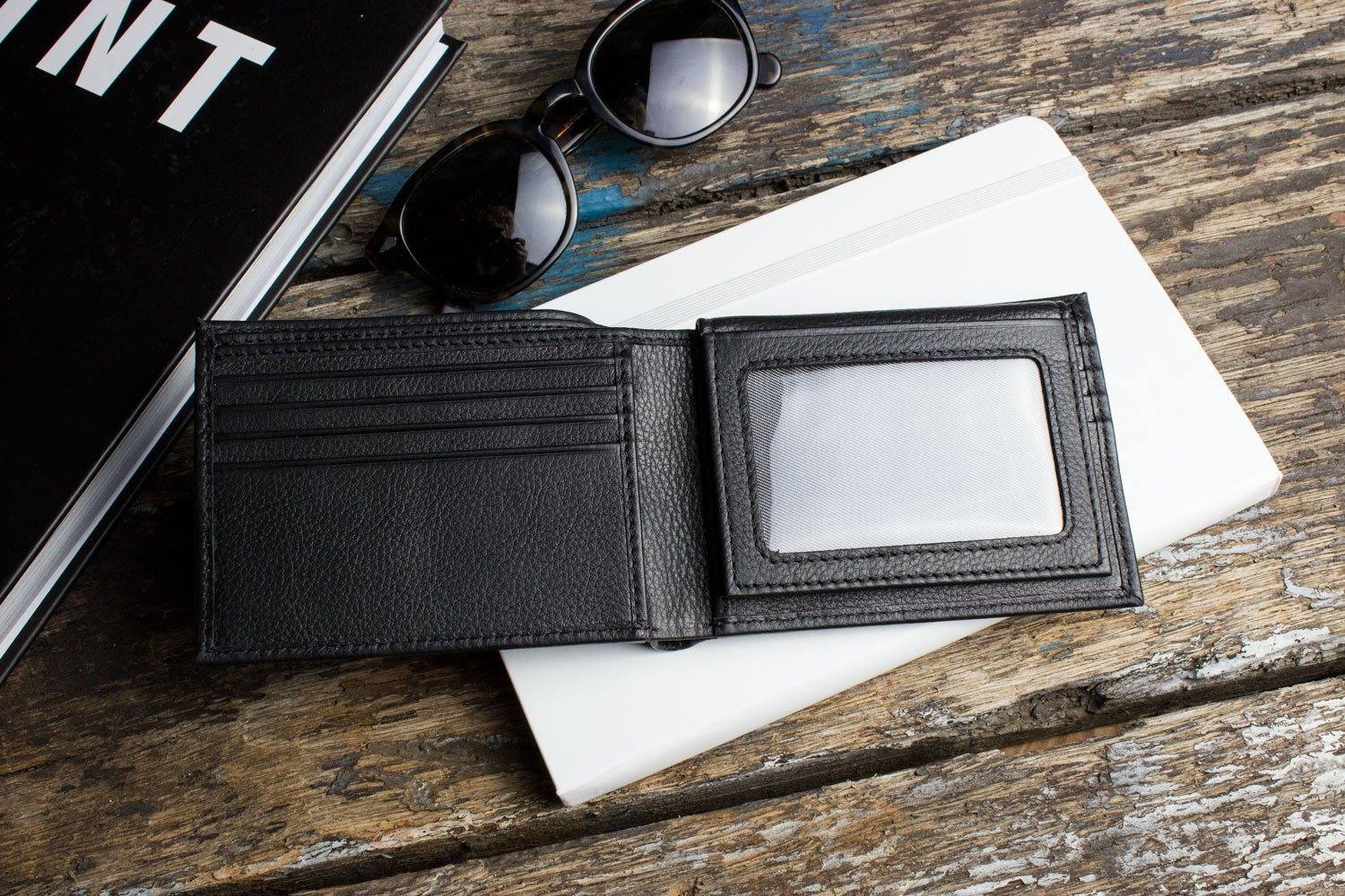 Traditional bifold wallet made of glove tanned cowhide leather with 8 card slots and removable ID window.