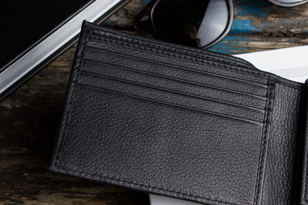 Traditional bifold wallet made of glove tanned cowhide leather with removable ID window and multiple card slots