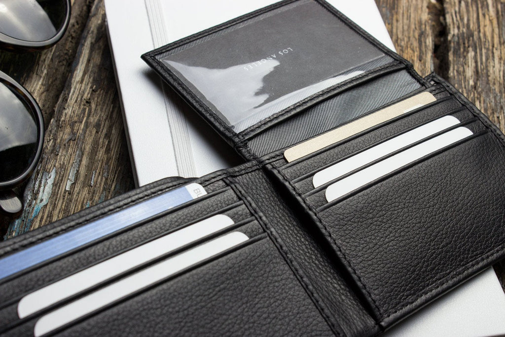 Traditional bifold wallet in glove tanned cowhide leather with removable ID window and multiple card slots