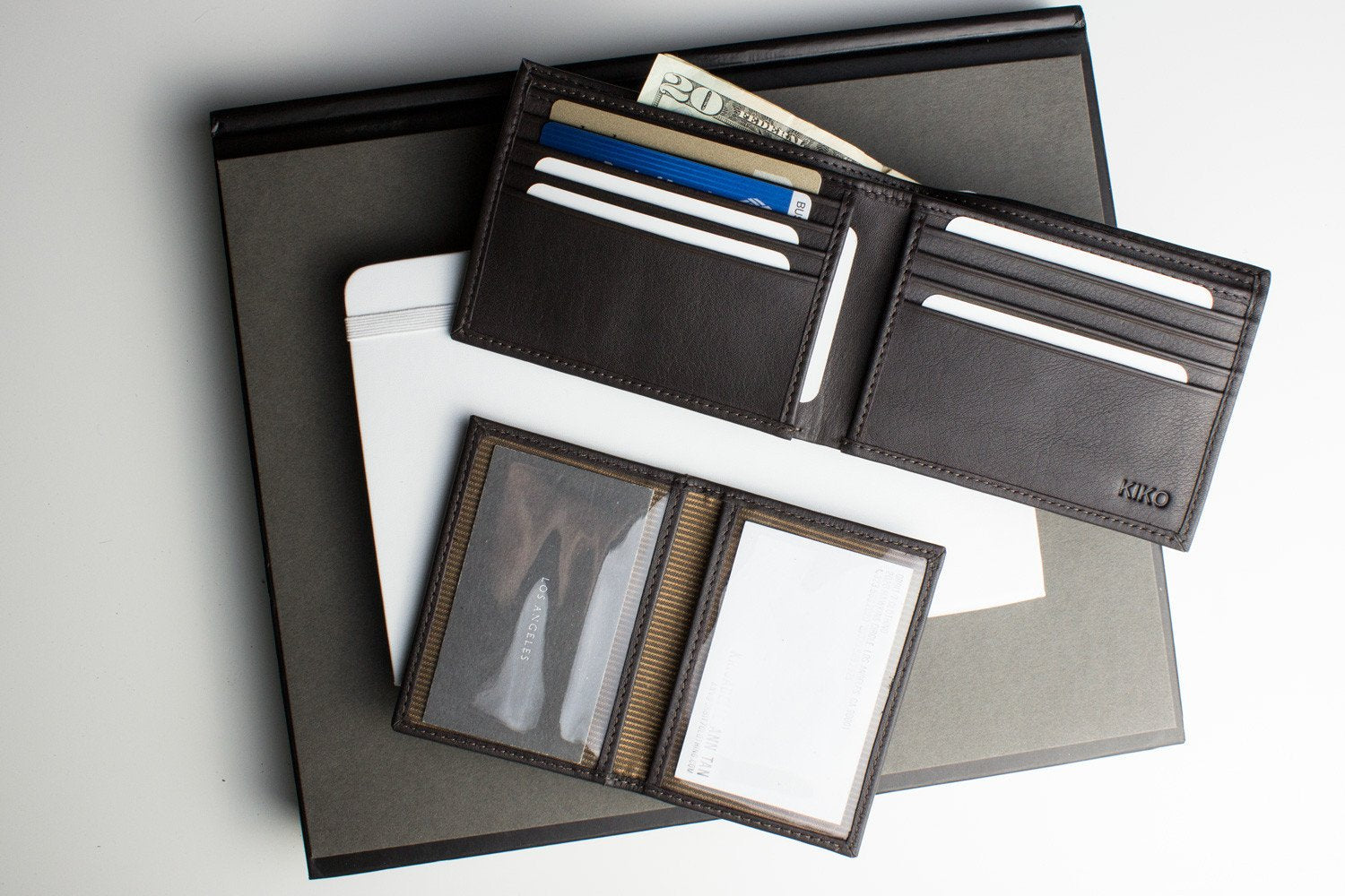 Traditional bifold wallet made of glove tanned cowhide leather with multiple card slots and ID window