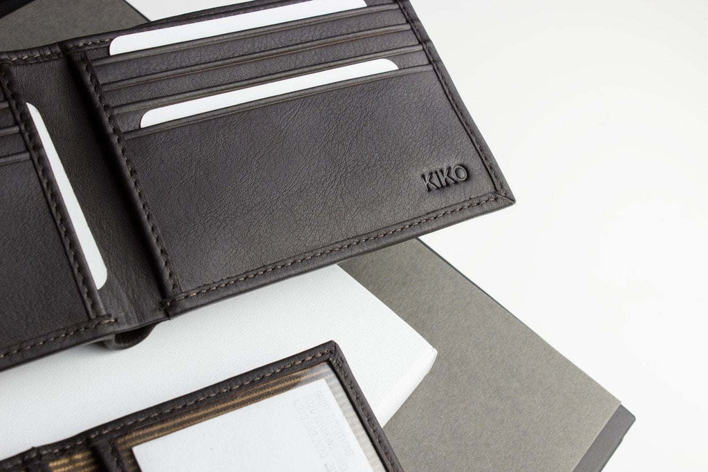 Traditional bifold wallet made of glove tanned cowhide leather with ID window and card slots