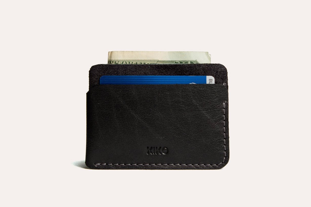 Minimalist leather triple pocket card wallet with contrast stitching and handcrafted design