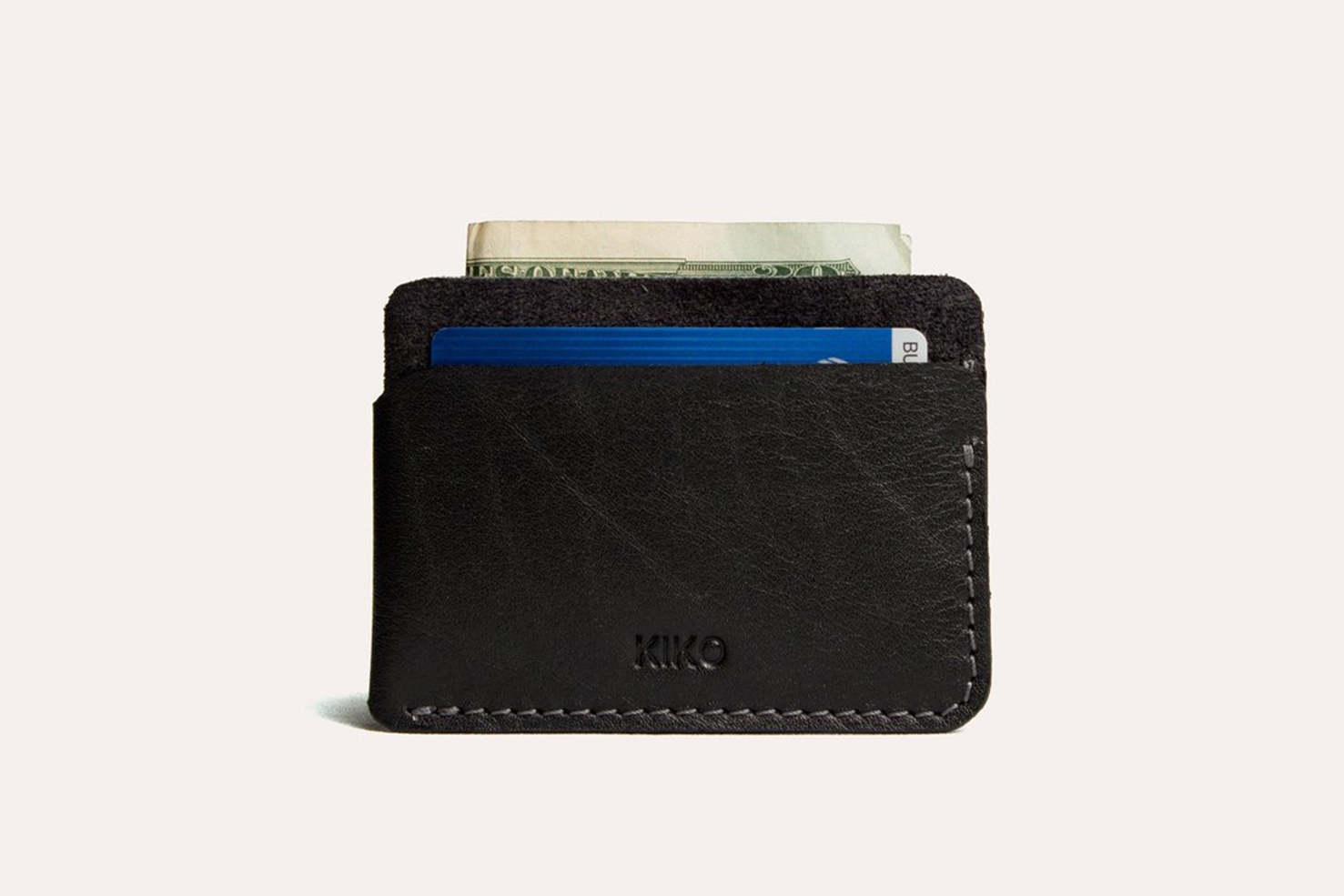 Minimalist leather triple pocket card wallet with contrast stitching and handcrafted design