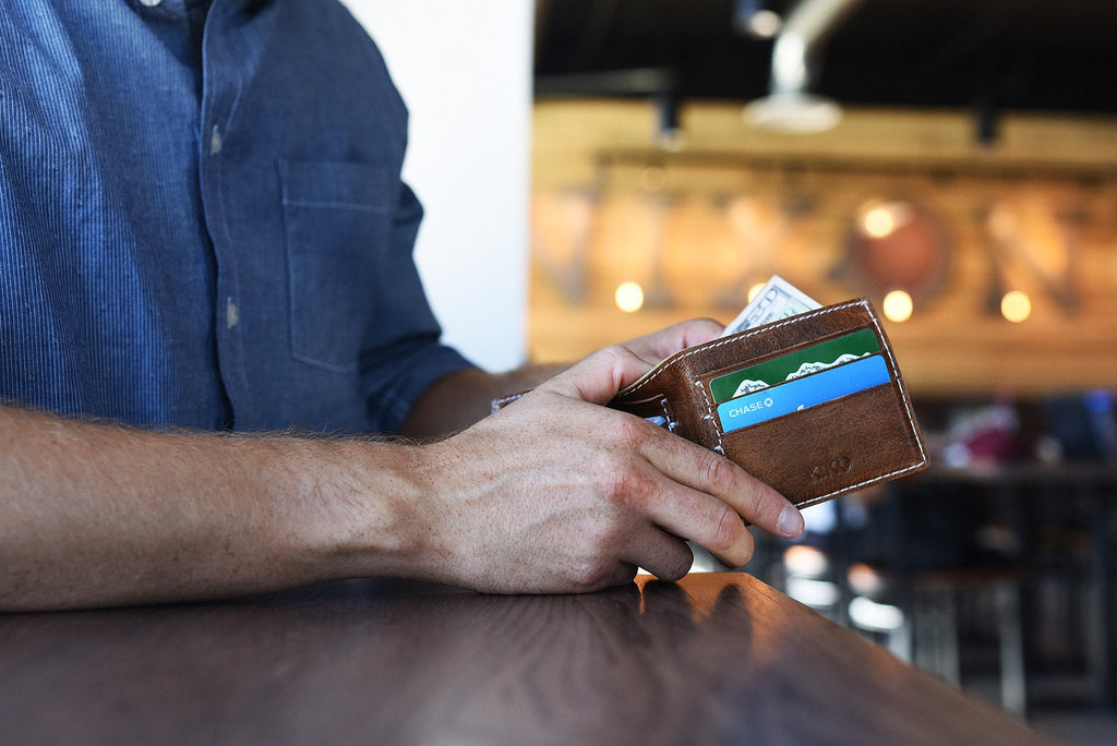 Minimalist Leather X Bifold Wallet with white stitching and five card slots, handmade artisan design