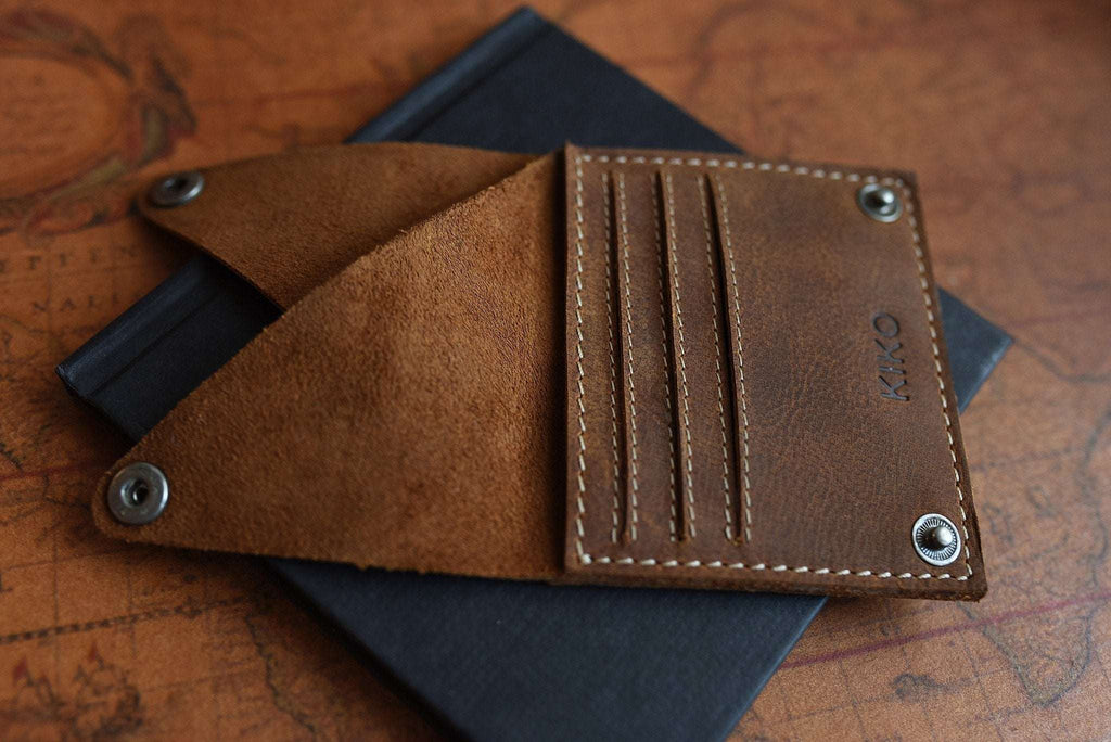 Kiko Wing fold wallet with geometric leather design and white stitching