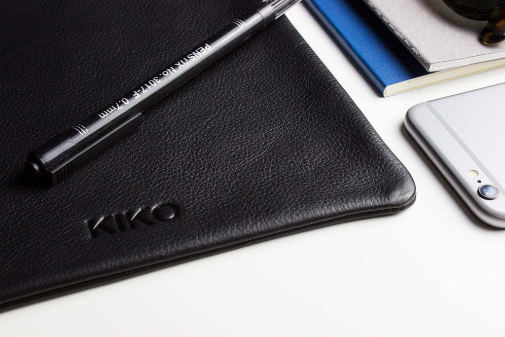 Kiko Much Needed Accessory Pouch made of cowhide leather with adjustable pull string closure and suede lining