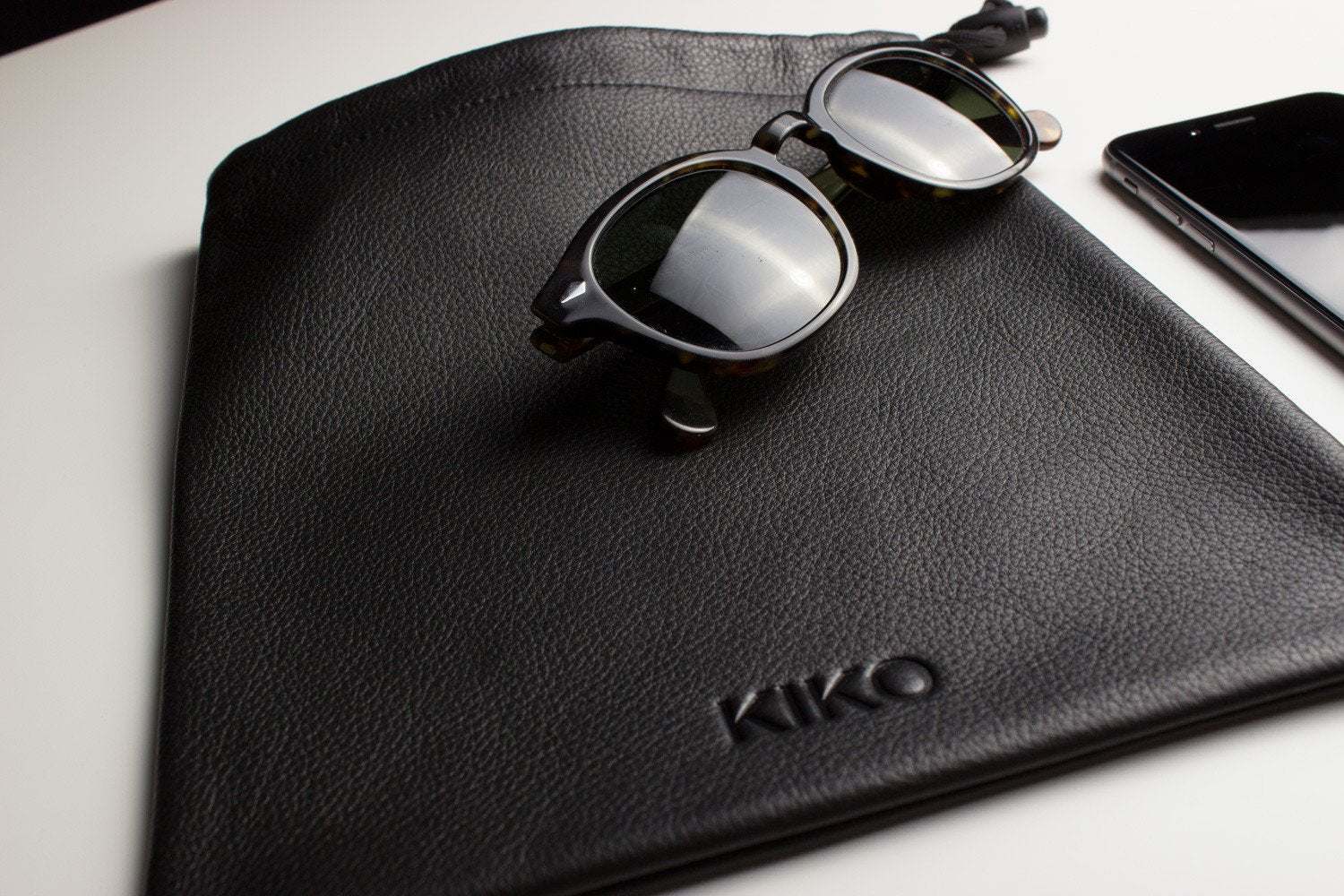 Kiko much needed accessory pouch made of cowhide leather with adjustable pull string closure and suede lining