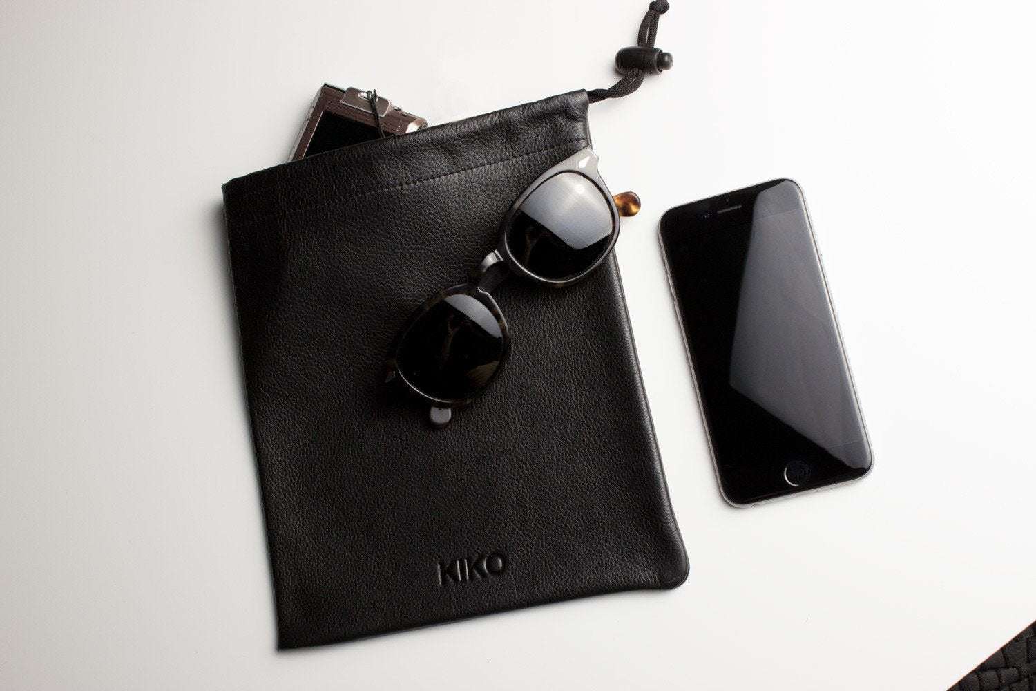 Kiko Much Needed Accessory Pouch cowhide leather with adjustable pull string closure and suede lining