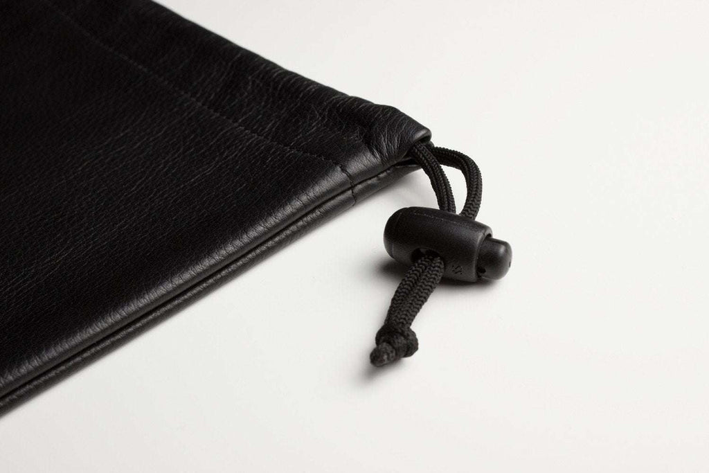 Kiko Much Needed Accessory Pouch in suede-lined cowhide leather with adjustable pull string closure, 7¼ x 9 inches
