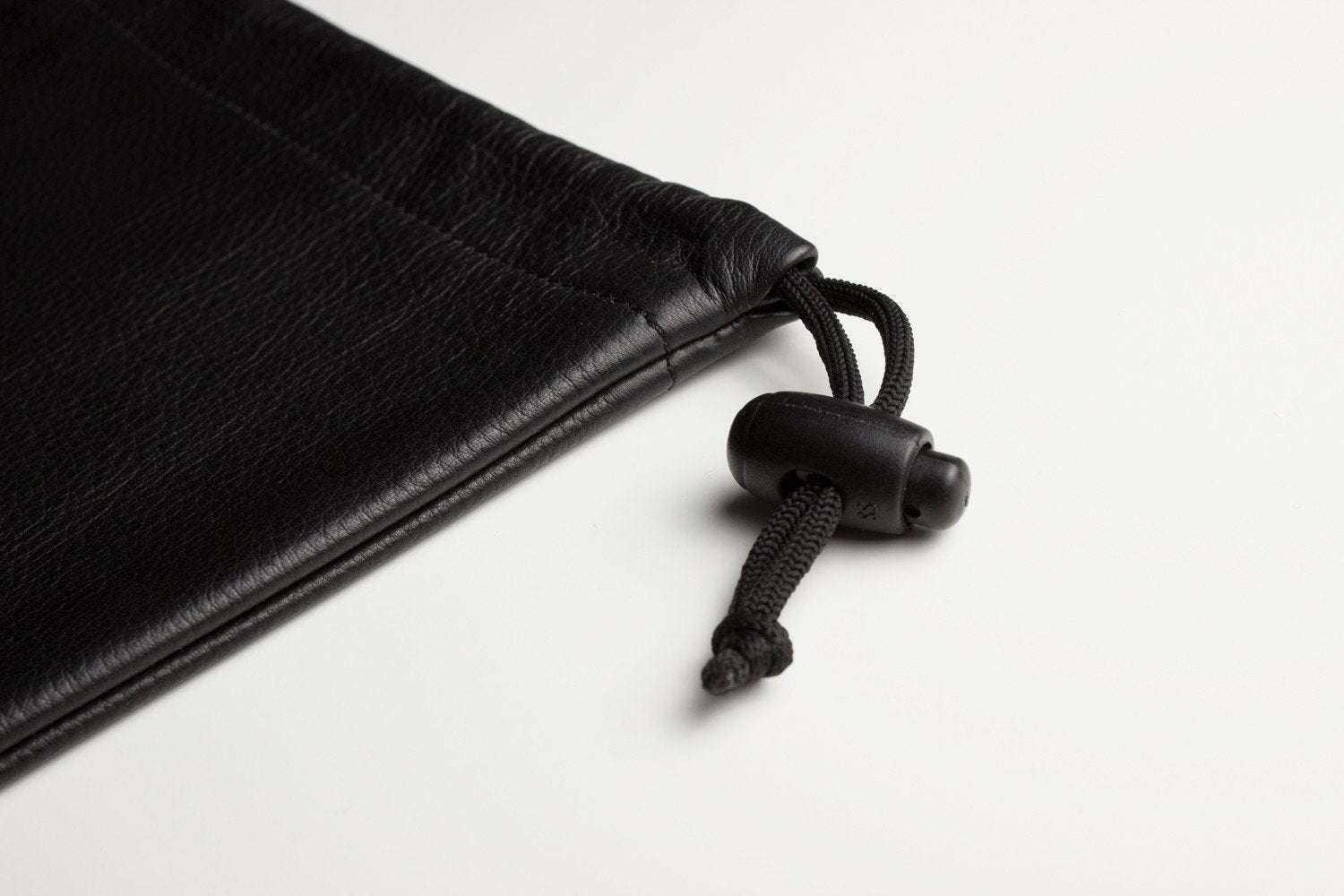 Kiko Much Needed Accessory Pouch in suede-lined cowhide leather with adjustable pull string closure, 7¼ x 9 inches