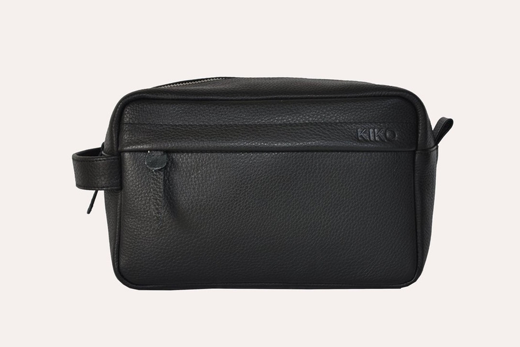 Premium black pebble leather travel kit with YKK zipper and side pouch for organized grooming essentials