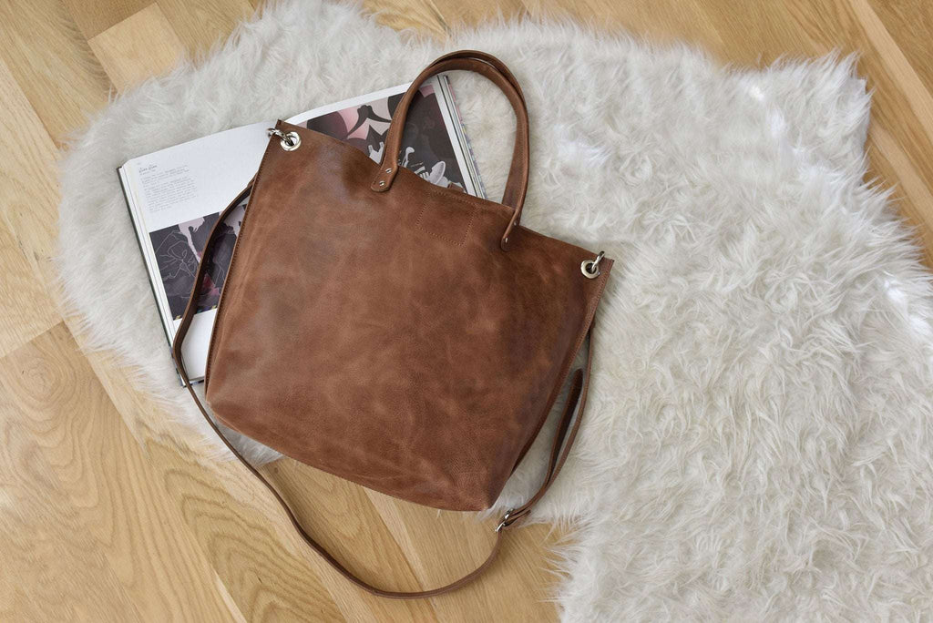 Caramel leather Paseo Shoulder Bag with removable strap and central button closure
