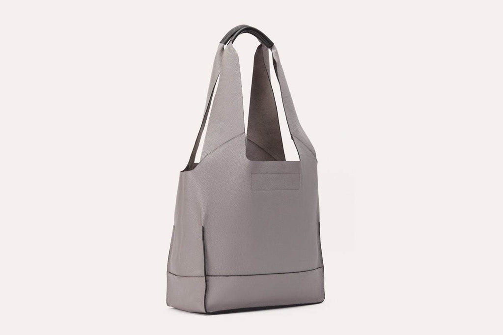 Genuine pebble leather shoulder bag with leather tie closure and 2 internal pockets