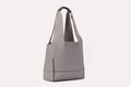 Genuine pebble leather shoulder bag with leather tie closure and 2 internal pockets