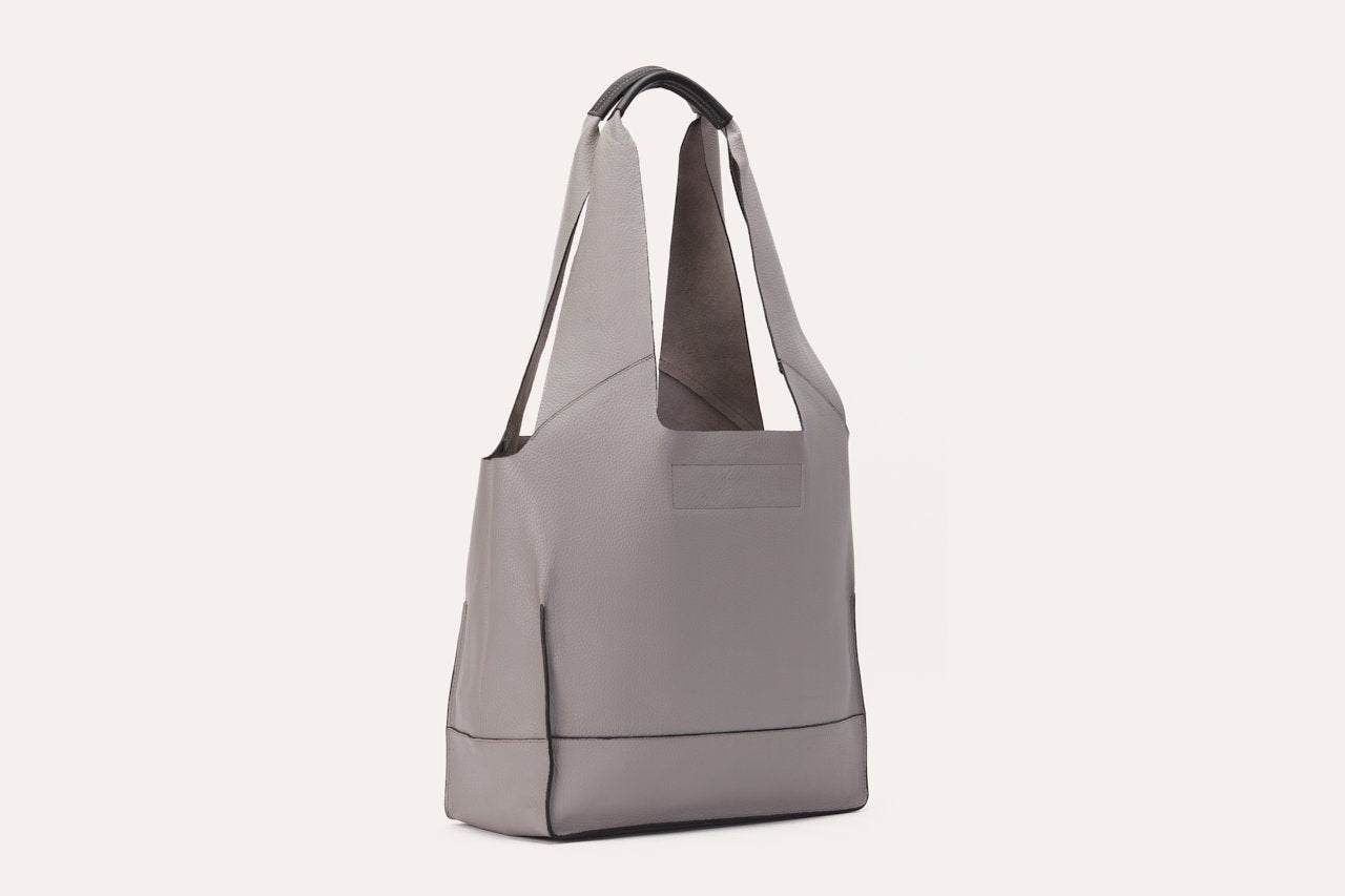 Genuine pebble leather shoulder bag with leather tie closure and 2 internal pockets