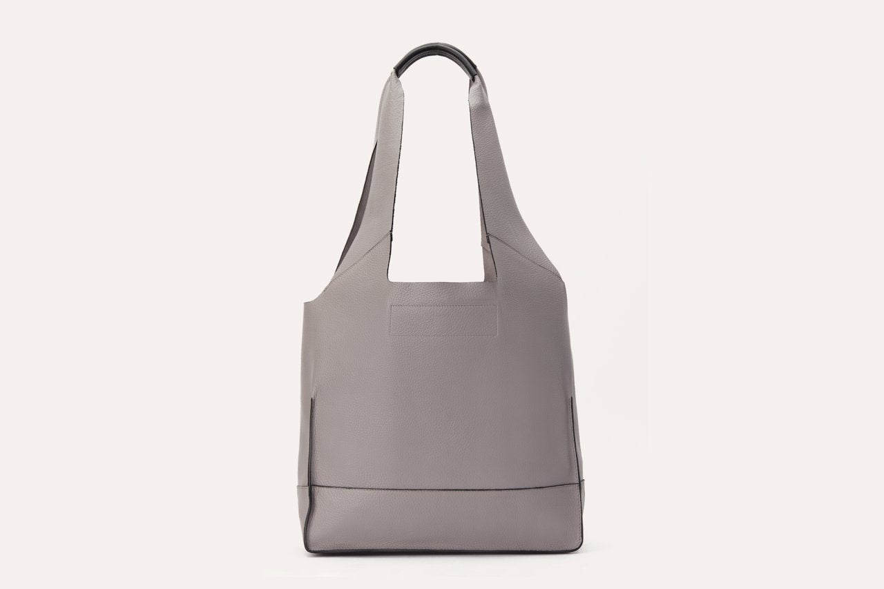 Genuine pebble leather modern design shoulder bag with leather tie closure and internal pockets