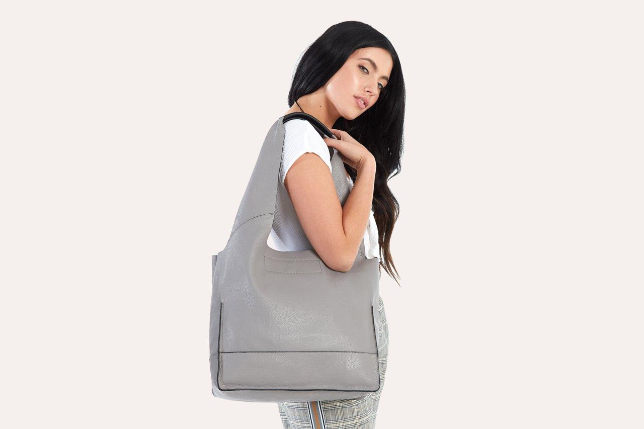 Genuine pebble leather modern design shoulder bag with stylish leather tie closure and internal pockets