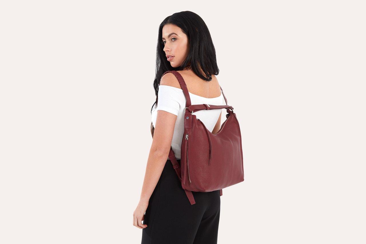 Genuine pebble leather versatile shoulder bag with adjustable straps and multiple pockets for work and travel