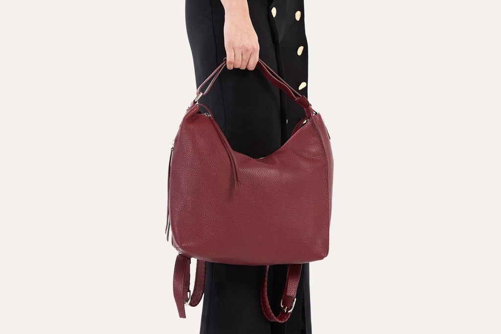 Genuine pebble leather versatile shoulder bag with adjustable straps and multiple pockets for work and travel