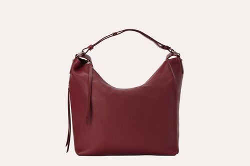 Genuine pebble leather versatile shoulder bag with adjustable straps and multiple pockets for work or travel