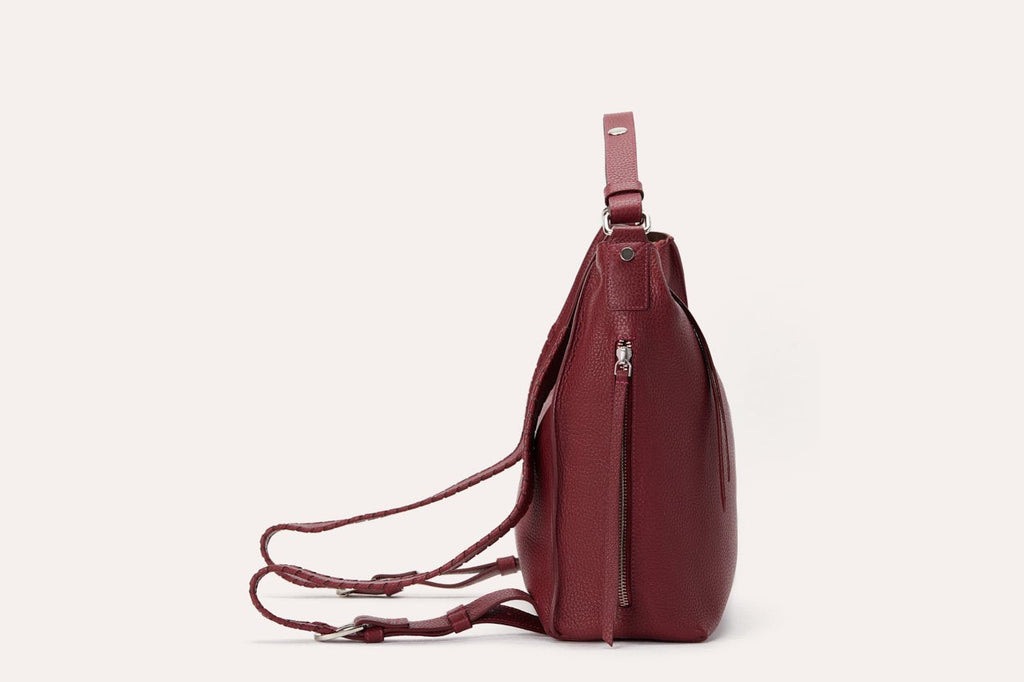 Genuine pebble leather versatile shoulder bag with adjustable straps and multiple pockets for work and travel